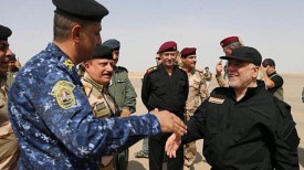 На фото справа: премьер-министр Ирака Хейдар аль-Абади
